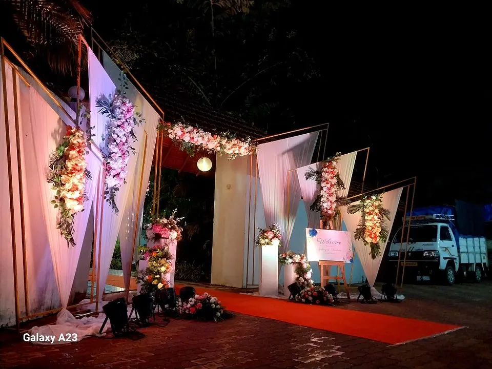Floral welcome entrance with triangular drapes and roses, Imagine Decorators Goa